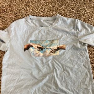 Touching hands painting on shirt
